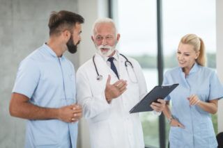 doctor talking with nurses