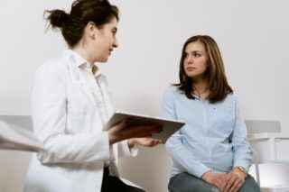 doctor giving analysis results to a patient