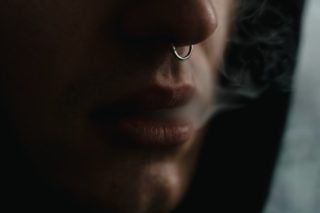 Person with Nose Ring Smoking